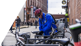 Cyclist locking up his bike.